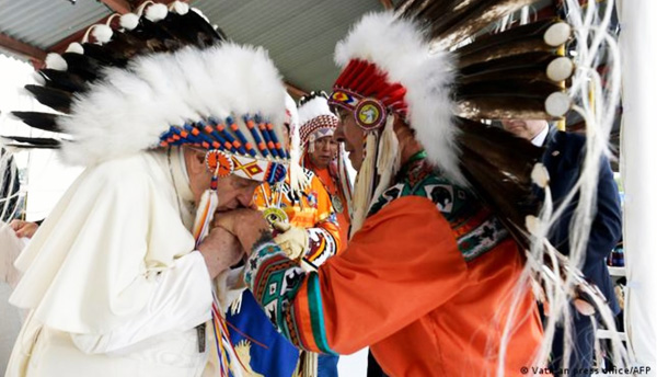 Francis with headdress in Canada